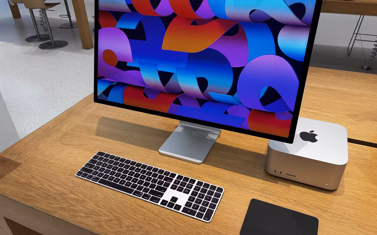 Apple Mac Studio beside a Studio Display, keyboard and trackpad in a store