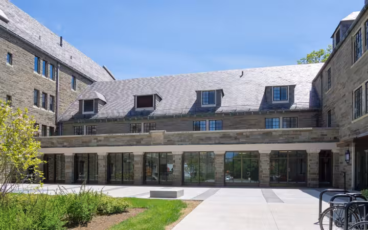 Hughes Hall at Cornell Law School, seen across a landscaped courtyard.