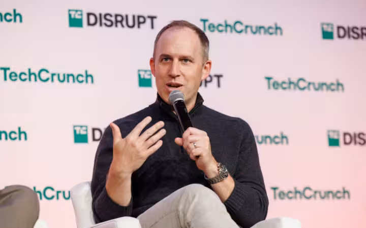 Bret Taylor speaks into a microphone at TechCrunch Disrupt 2024.
