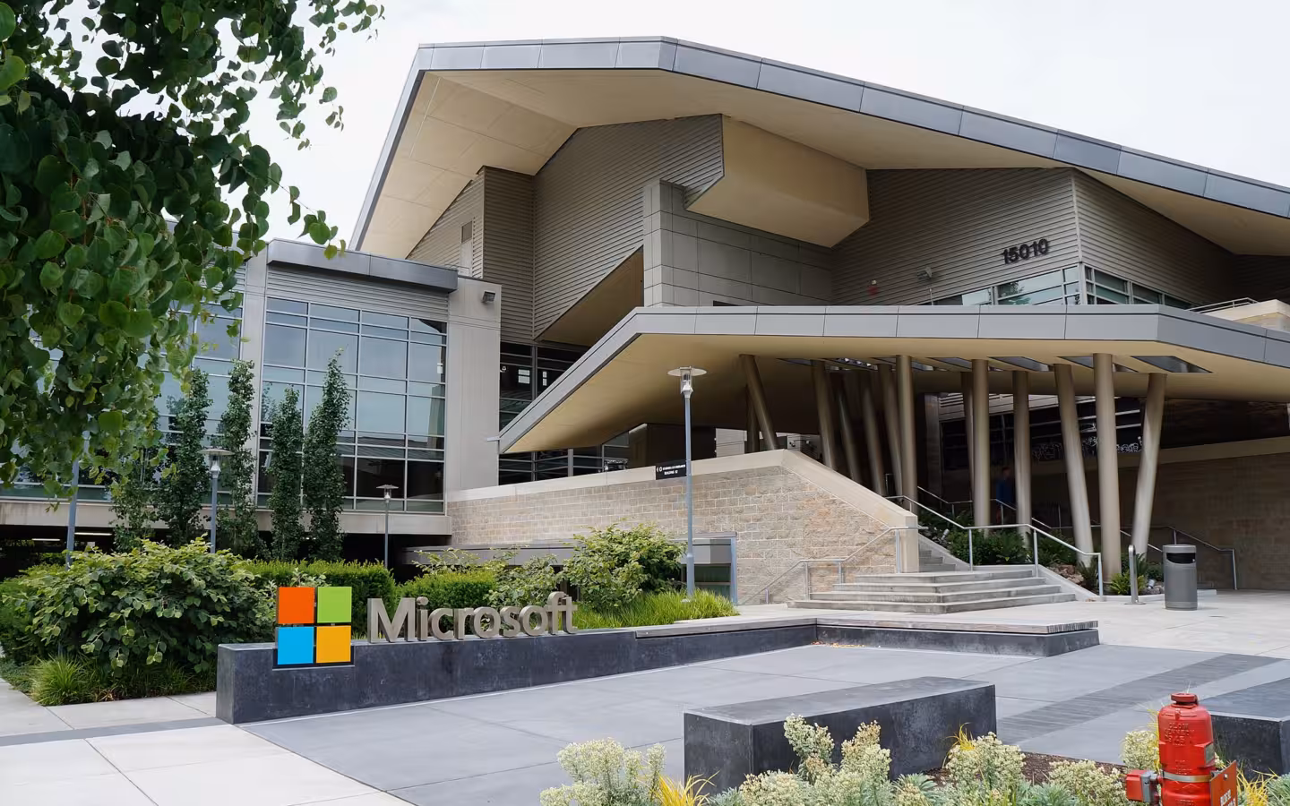 Building 92 of Microsoft Redmond Campus, with a Microsoft sign and landscaped entrance.