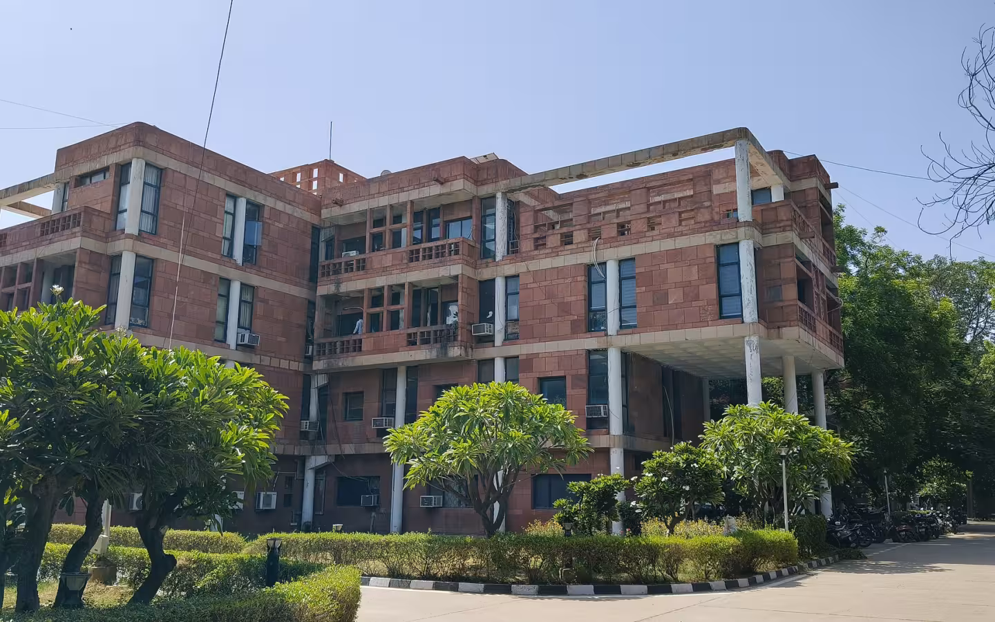 NCERT headquarters in New Delhi behind trees and landscaped grounds