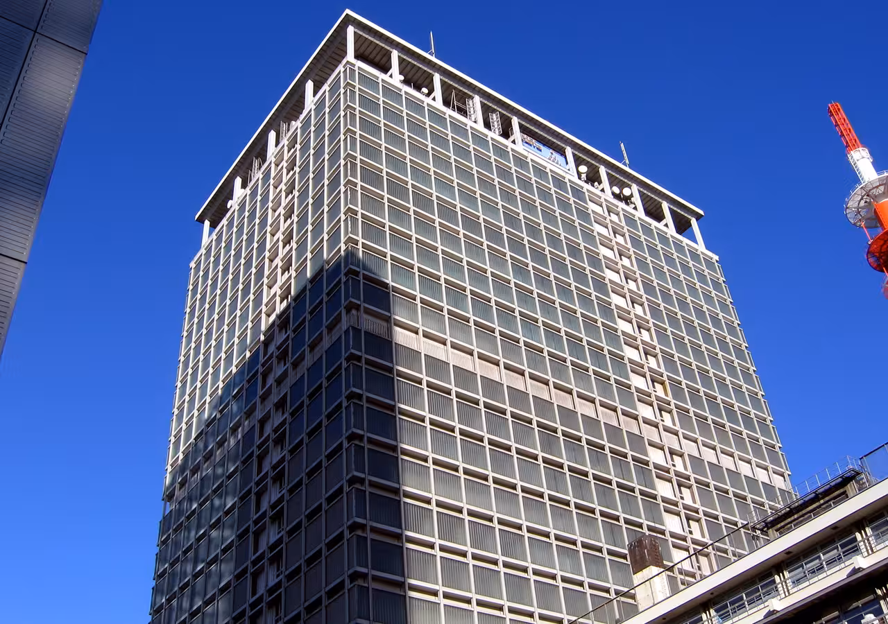 NTT Data Kansai Dojima Building rises against a blue sky in Osaka