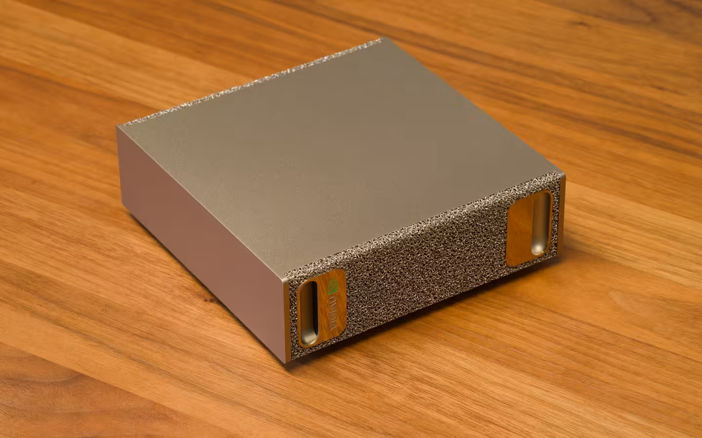 An NVIDIA DGX Spark sits on a wooden table in an oblique view.