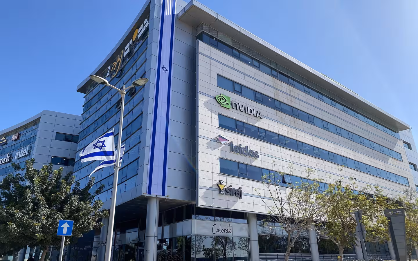 Nvidia office building in Be'er Sheva with company logos and Israeli flags