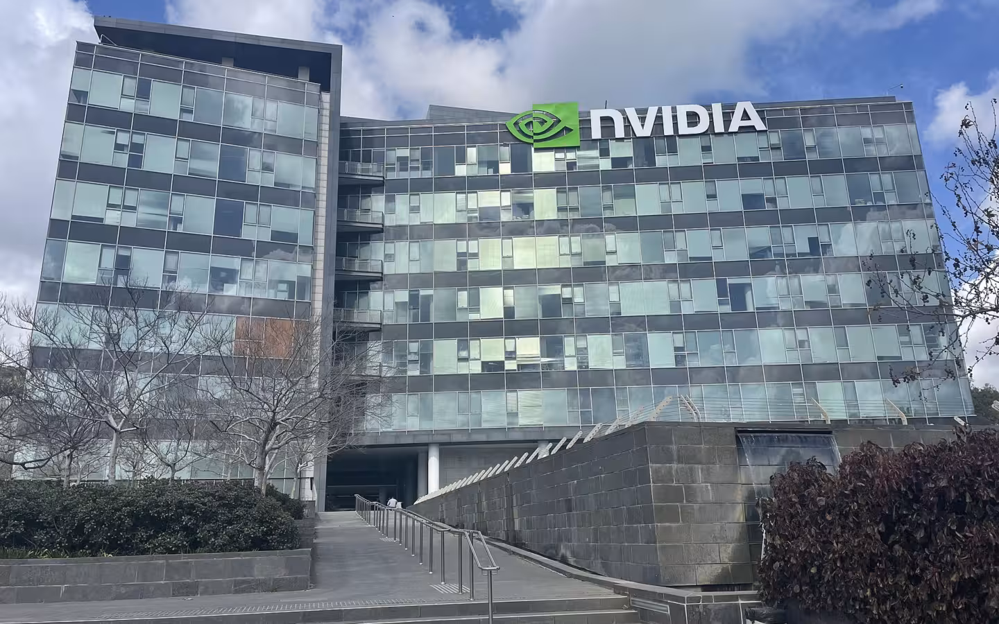 Nvidia's Yokneam office building with a prominent logo beneath a cloudy sky