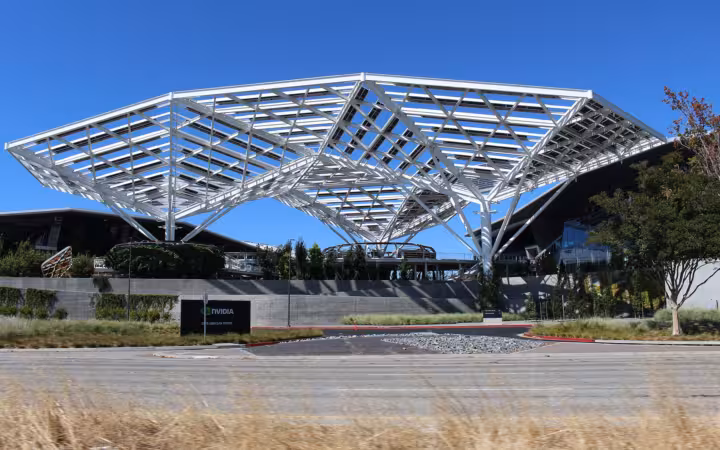 Nvidia headquarters entrance beneath a broad white canopy on a sunny day