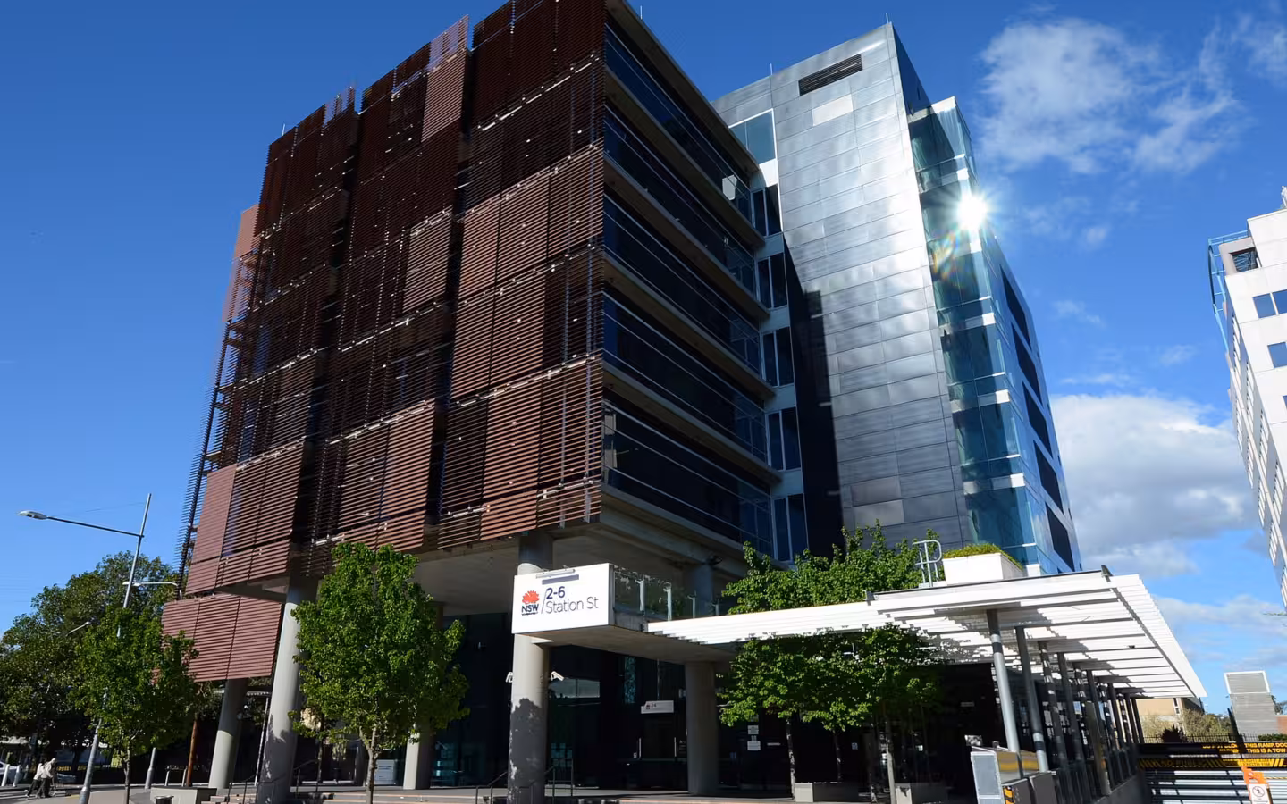 NSW Government offices in Penrith beside a street under blue skies