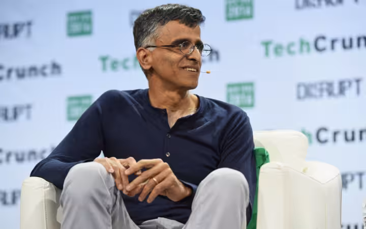 Sridhar Ramaswamy seated onstage before a TechCrunch Disrupt backdrop