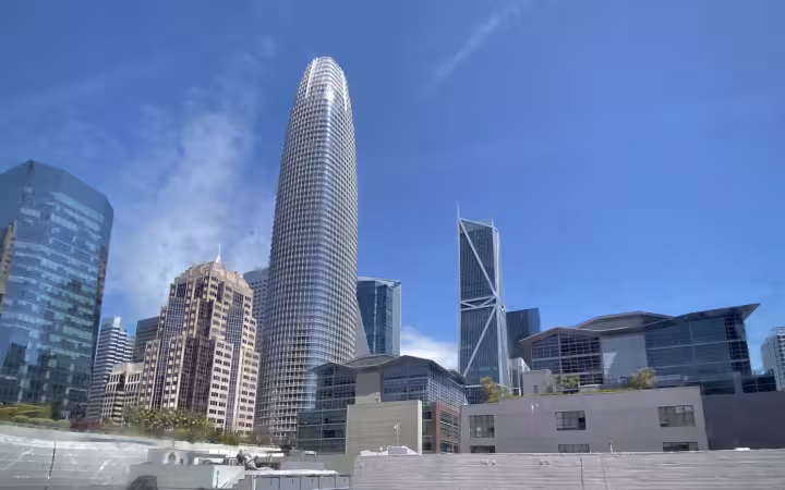 a wide exterior view of the San Francisco skyline featuring the Salesforce Tower