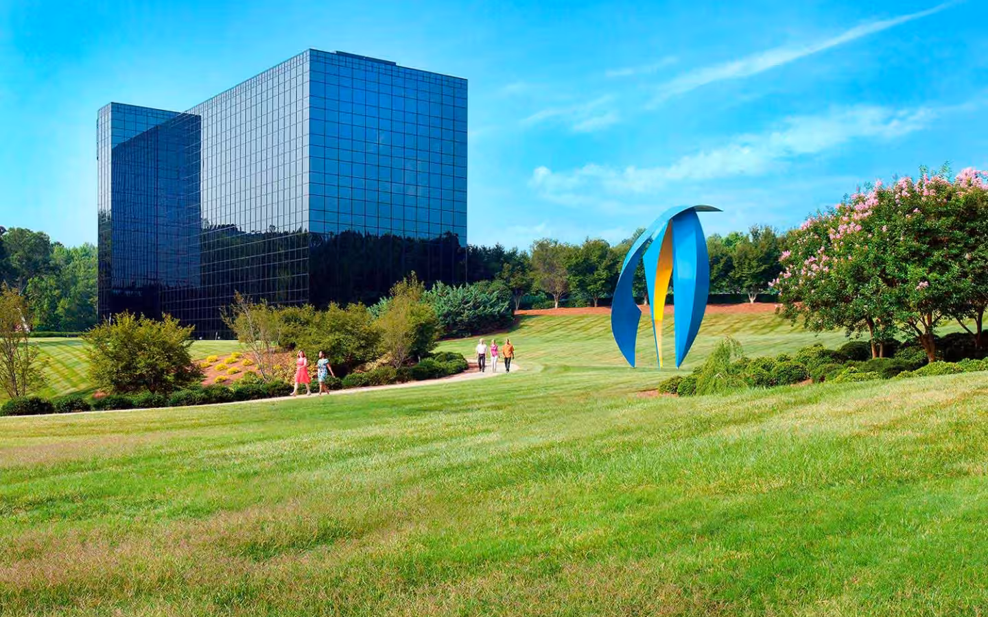 SAS Institute headquarters Building S beside a lawn and colorful sculpture