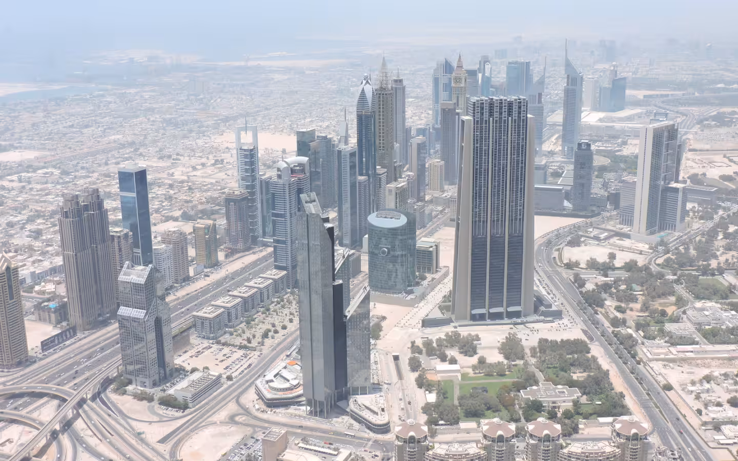 An aerial view of Dubai skyscrapers, roads and the financial centre