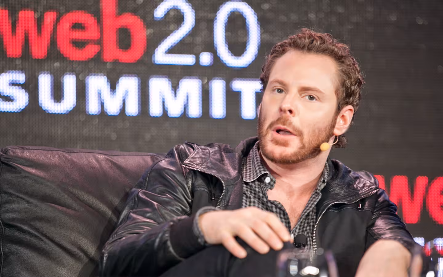 Sean Parker seated onstage before a Web 2.0 Summit backdrop.