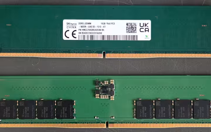 Two green SK hynix DDR5 memory modules photographed front and back.