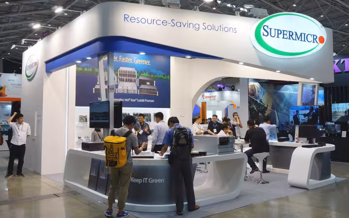 Visitors inspect equipment at the Super Micro Computer booth at Computex Taipei 2019.