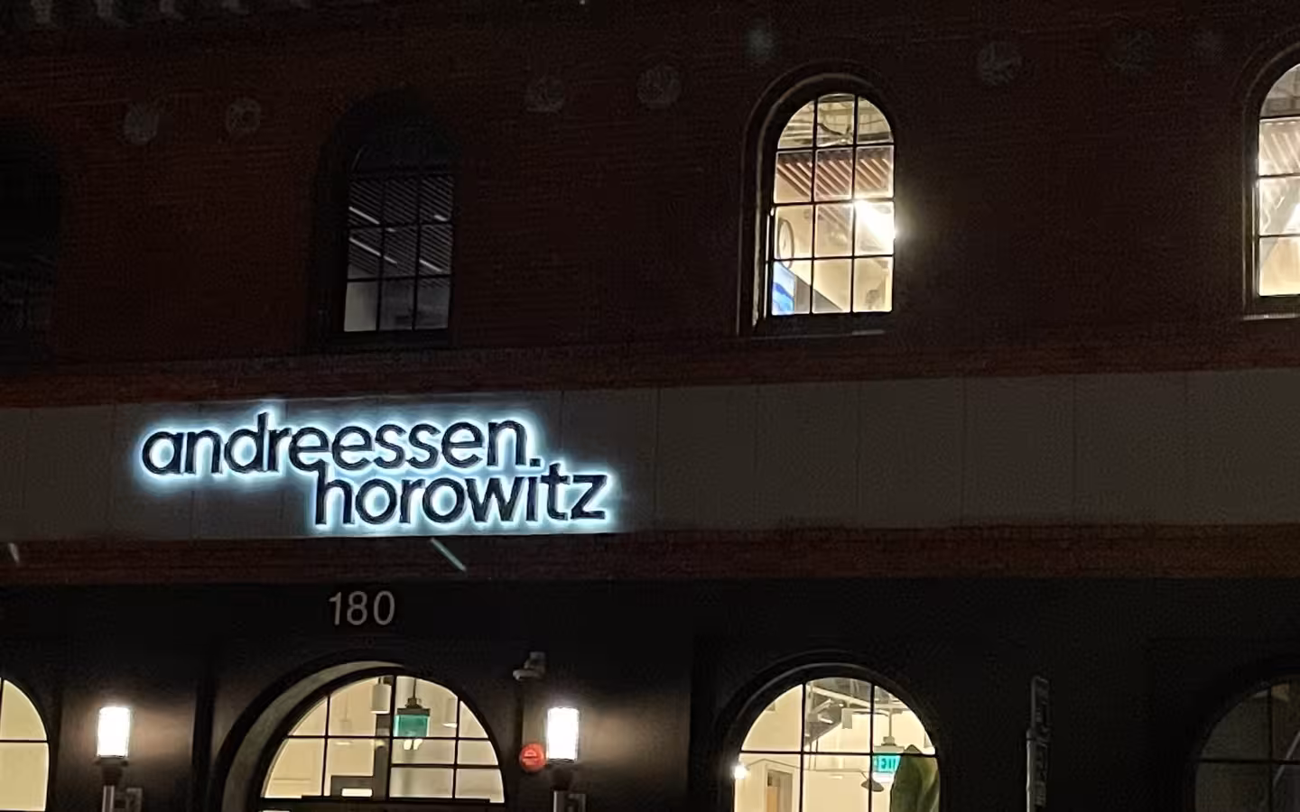 Illuminated Andreessen Horowitz sign on its building at night