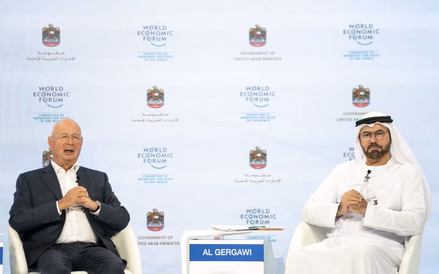 Mohammad Al Gergawi and Klaus Schwab seated before a World Economic Forum backdrop