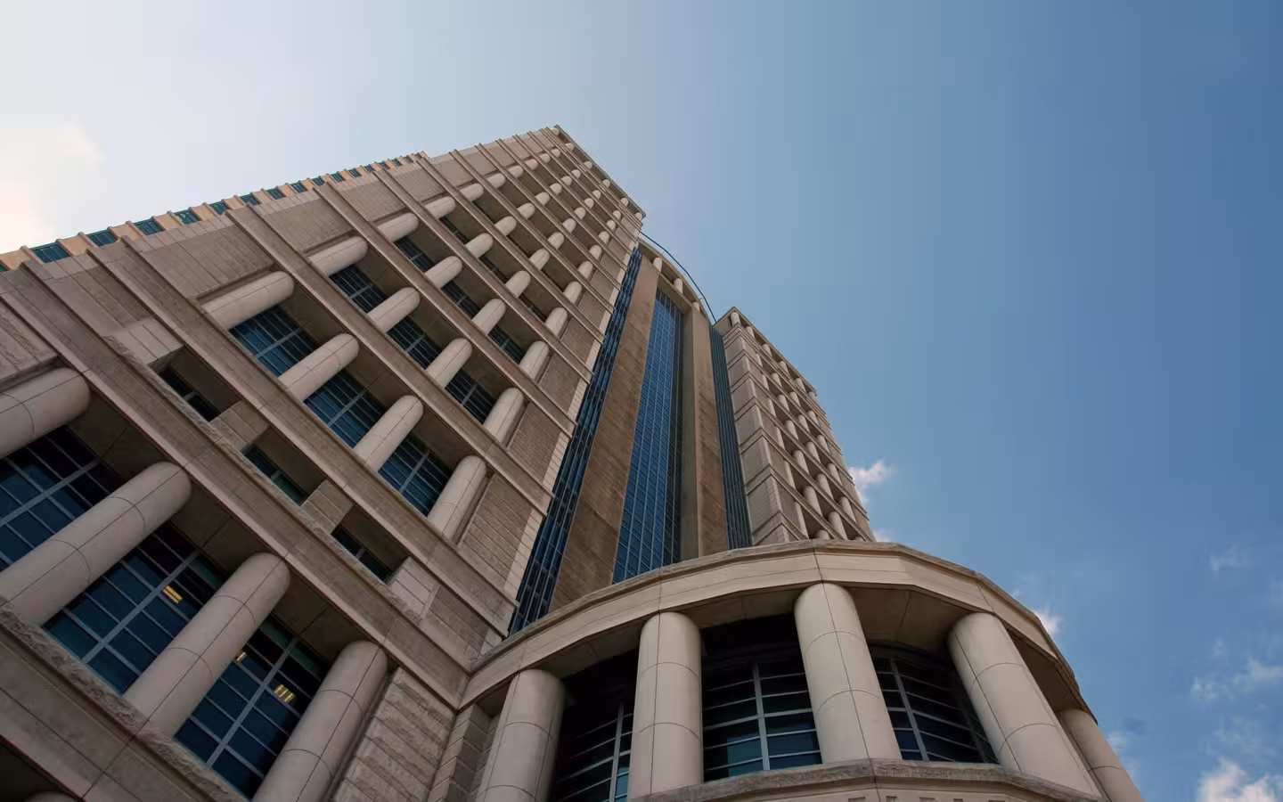 Thomas F. Eagleton U.S. Courthouse rises against a clear blue sky.