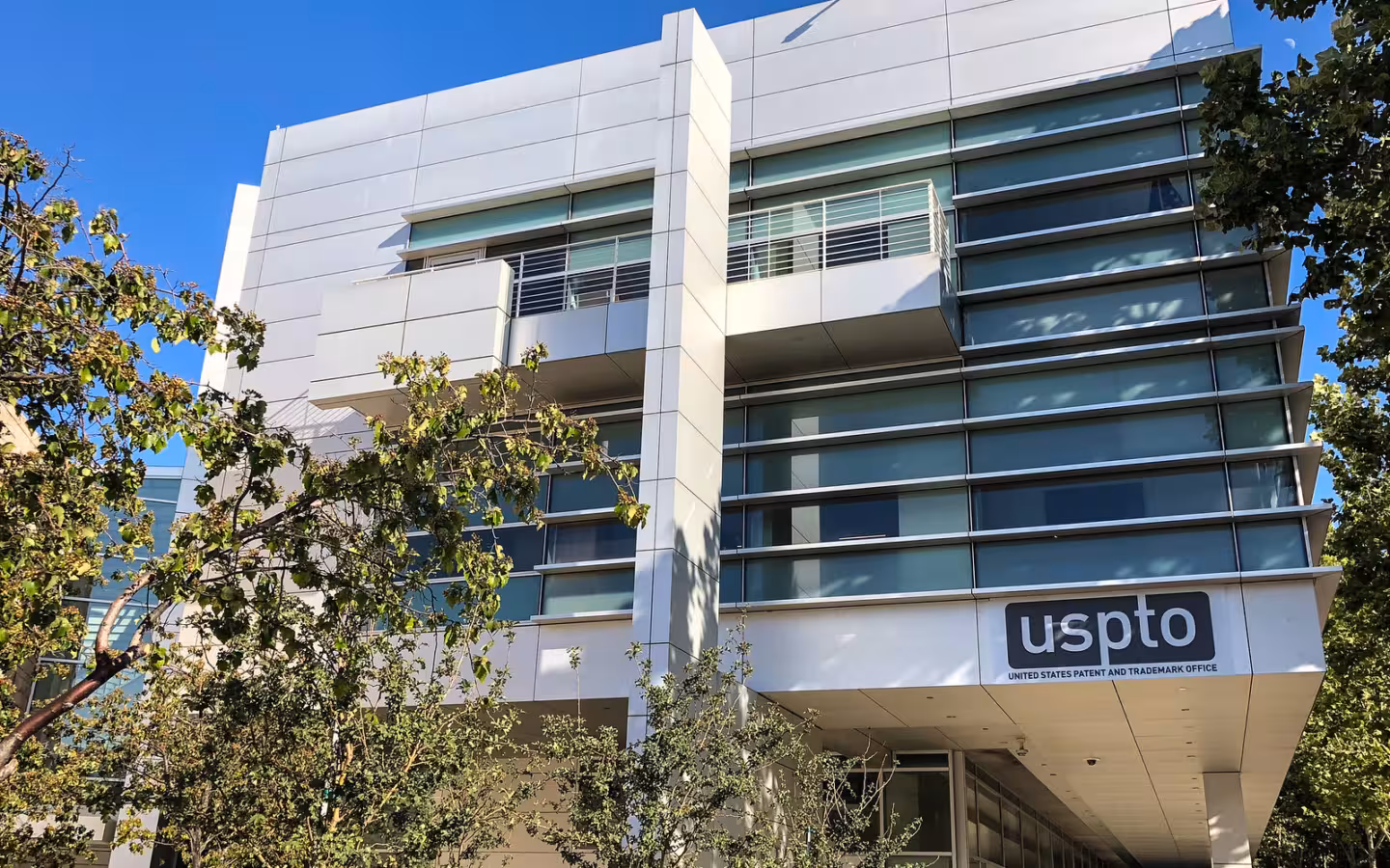 The USPTO’s Silicon Valley office building in San Jose, partly screened by trees