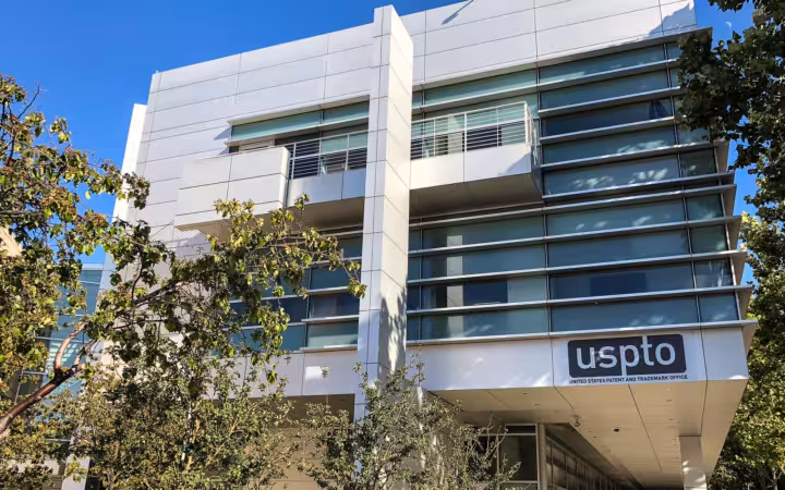 The USPTO’s Silicon Valley office building in San Jose, partly screened by trees