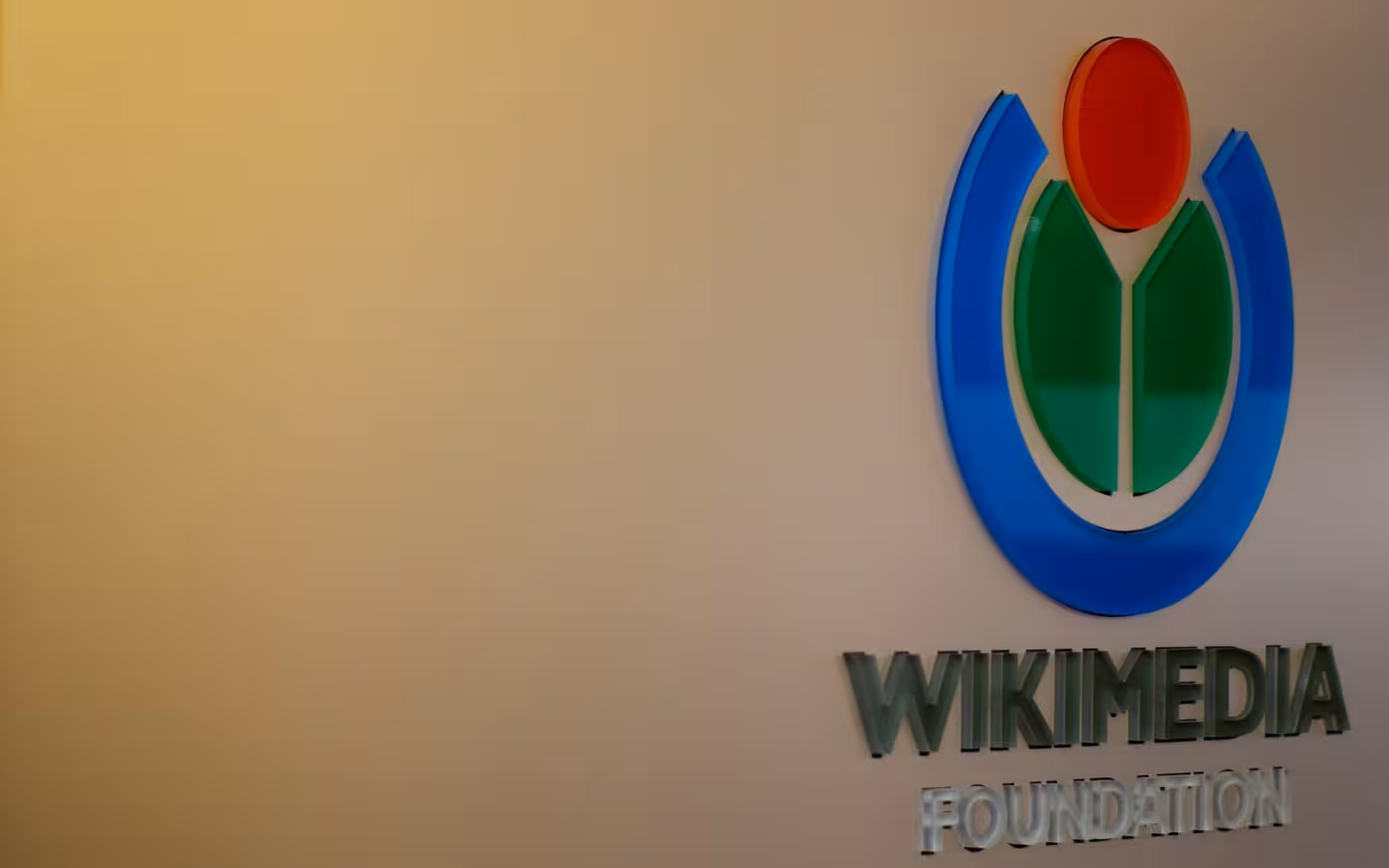 Wikimedia Foundation logo and lettering mounted on a wall at its headquarters